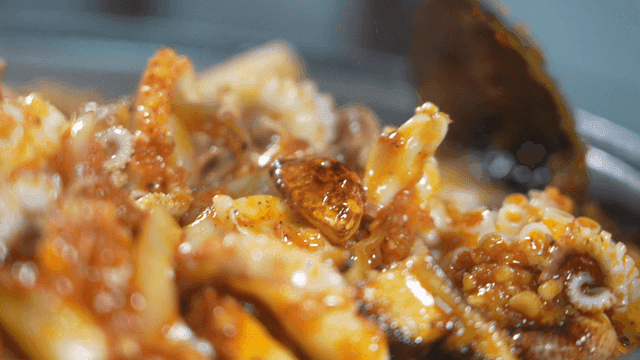 Spicy stir-fried octopus in a pan