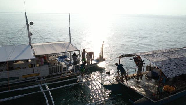 People enjoying the afternoon sea on a traditional Philippine boat, Banka