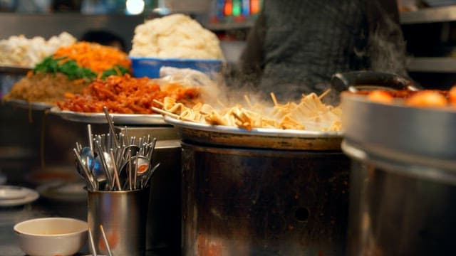 Various Korean street foods prepared at Gwangjang Market