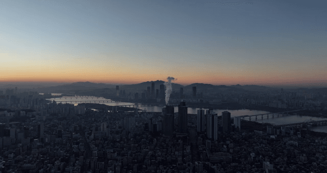 City skyline at dawn with a river view