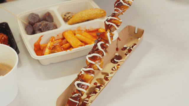 Assorted plate of chicken skewers and tteokbokki