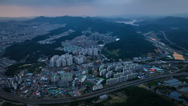Sprawling city with surrounding mountains