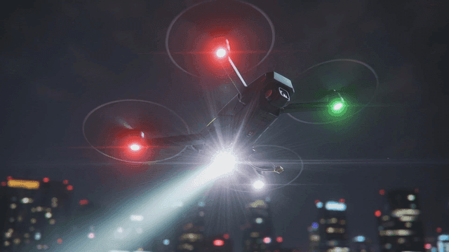 Drones flying over city at night