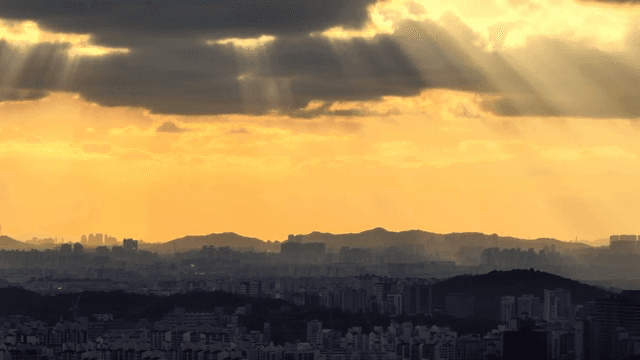 Sunlight streaming over a city skyline