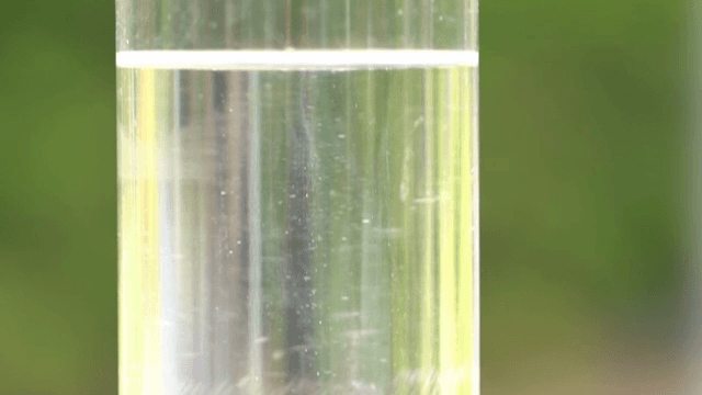 Clear liquid in a glass cylinder