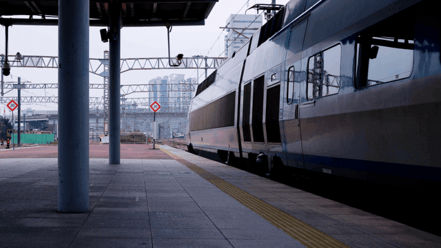 High-speed train stopping at platform station
