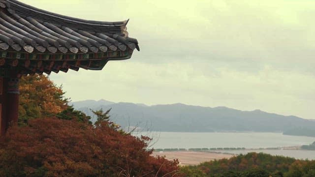 Traditional Korean Rooftop Overlooking Scenic Landscape