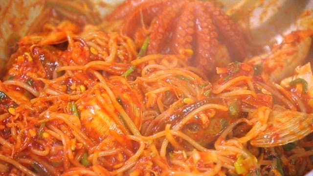 Steaming braised seafood dish with plenty of seafood such as octopus and bean sprouts