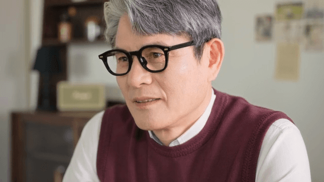 Elderly man smiles and then turns expressionless