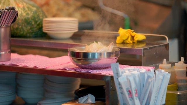 Steaming ginseng chicken soup on a market stall