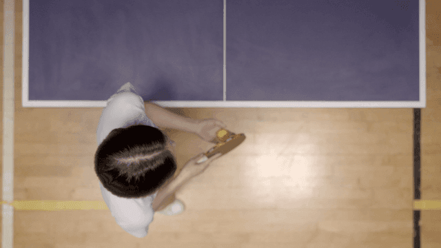 Person preparing to serve table tennis game