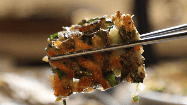 Seafood pancake dipped in soy sauce