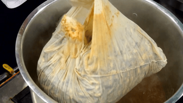Bag taken out of a large boiling pot