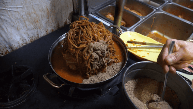 Pork backbone stew with sweet potato stems sprinkled with perilla seed powder