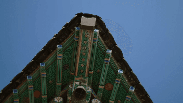 Traditional Korean roof against blue sky
