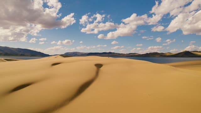 Wide and Vast Sand Dunes by a Lake