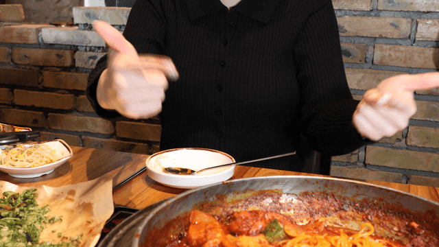 Woman admires spicy jjagalchi