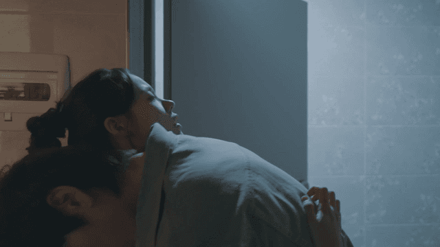 Drunk man hugging woman