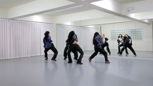 K-POP Dancers Practicing in a Studio