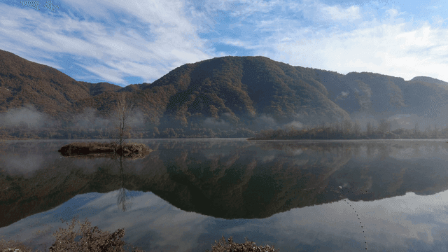 Misty mountains and tranquil lake