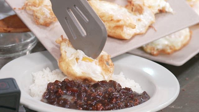 Fried Egg on Top of Black Bean Sauce with Rice