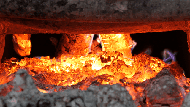 Glowing embers in a furnace