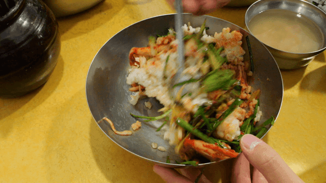 Mixing bibimbap with various vegetables