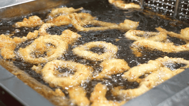 Onion rings fried in hot oil