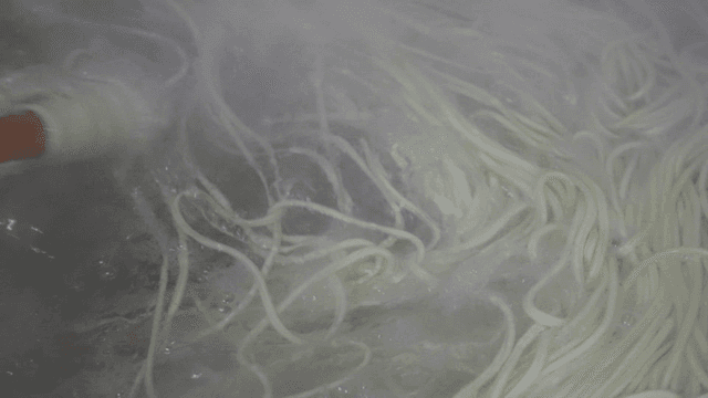Noodles boiling in a pot