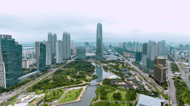 Modern city skyline with green parks