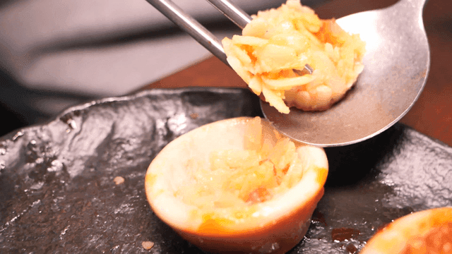 Chopsticks for scooping squid sundae filling onto spoon