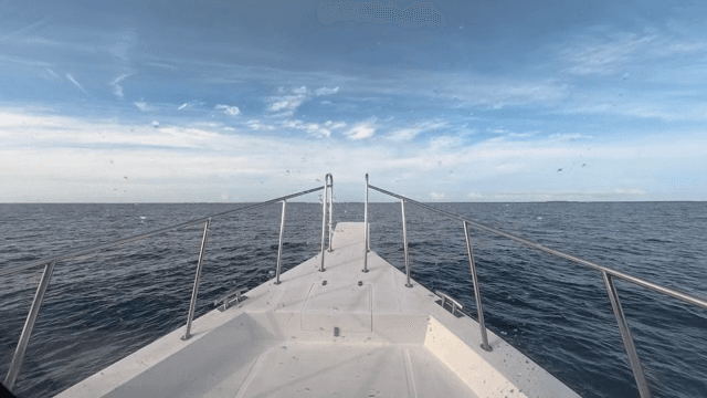 A yacht sailing on a calm sea