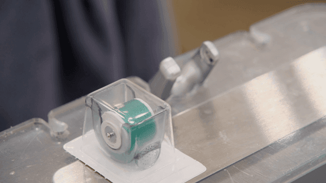 Close-up of a dental tool and tape