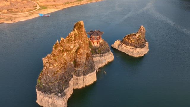 Traditional pavilion on rocky islets