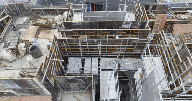 Construction site with workers and scaffolding