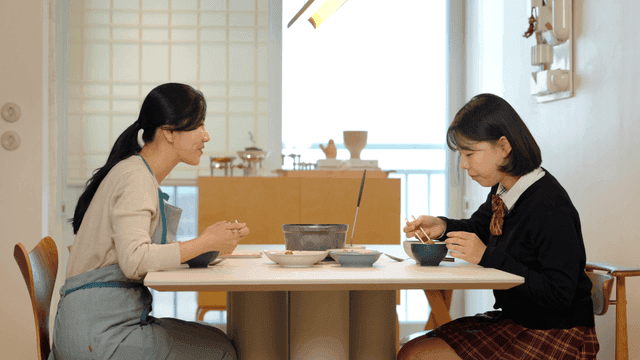 Mother and daughter enjoying a meal together