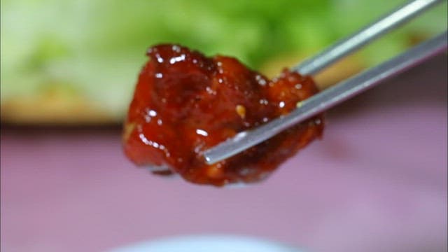 Chopstickful of spicy and delicious braised pork ribs