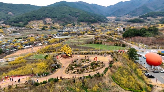 Scenic village with mountains and fields