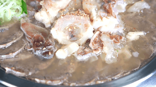 Boiled pork stew boiling in pot