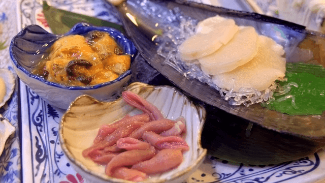 Assorted seafood dishes on a plate