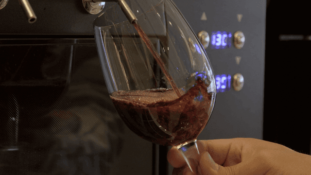 Wine being poured into a glass