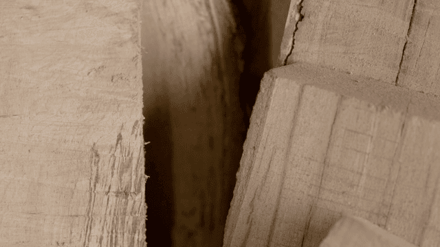 Close-up view of stacked wooden logs