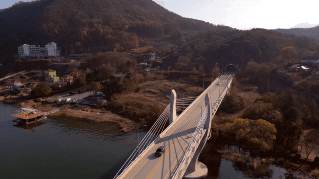 Bridge over a river with mountains