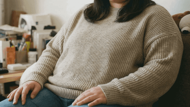 Fat woman sitting on sofa