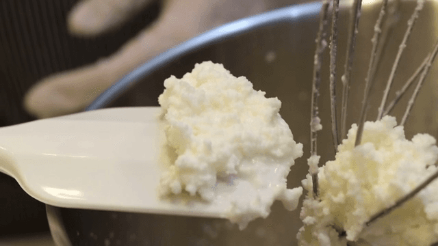 Whipped cream in a mixing bowl