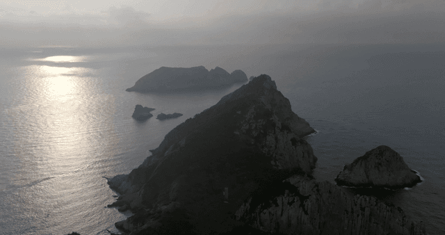 A serene island with surrounding sea
