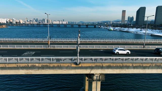 City Bridge over River with Moving Traffic