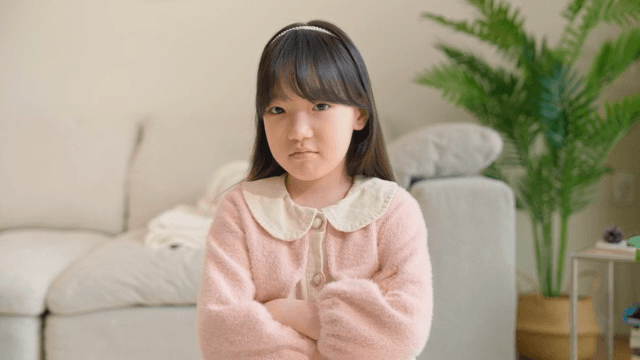 Sulky child with her arms crossed