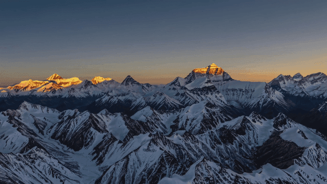 Snow-capped mountains at sunrise