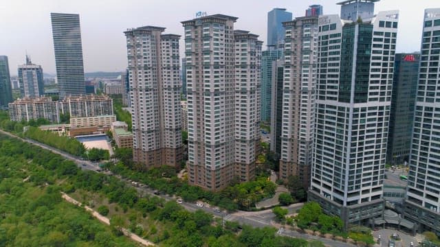 Urban Residential Complex with Green Park in Front